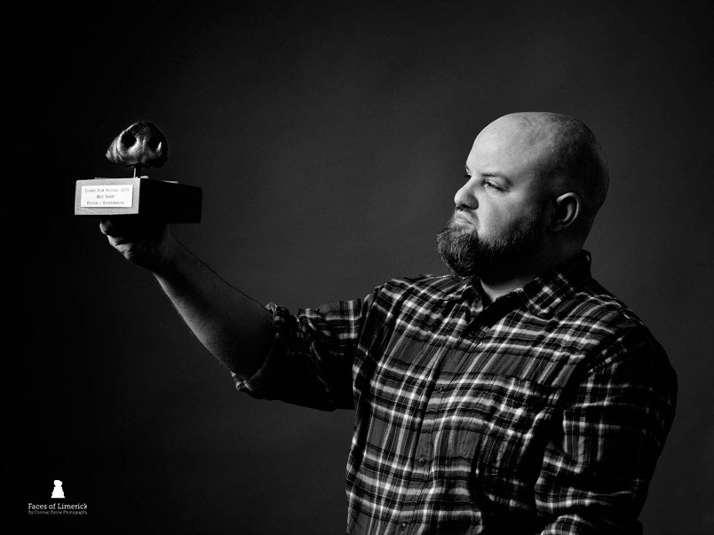 
Jonathan hears voices — a useful trait for an award-winning screenwriter and filmmaker originally from Co. Monaghan. His work blends surrealism with dark comedy, horror, and the messy oddities of human behaviour. Funded by Screen Ireland, RTÉ, the Arts Council and others. He has called Limerick home for the past seven years — ever since he fell for a Limerick man and refused to leave his flat.

